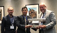 Award to Paul Chan (between Mr. Doug Jensen and the Honorable Todd Smith) for his contribution to the CANDU technology