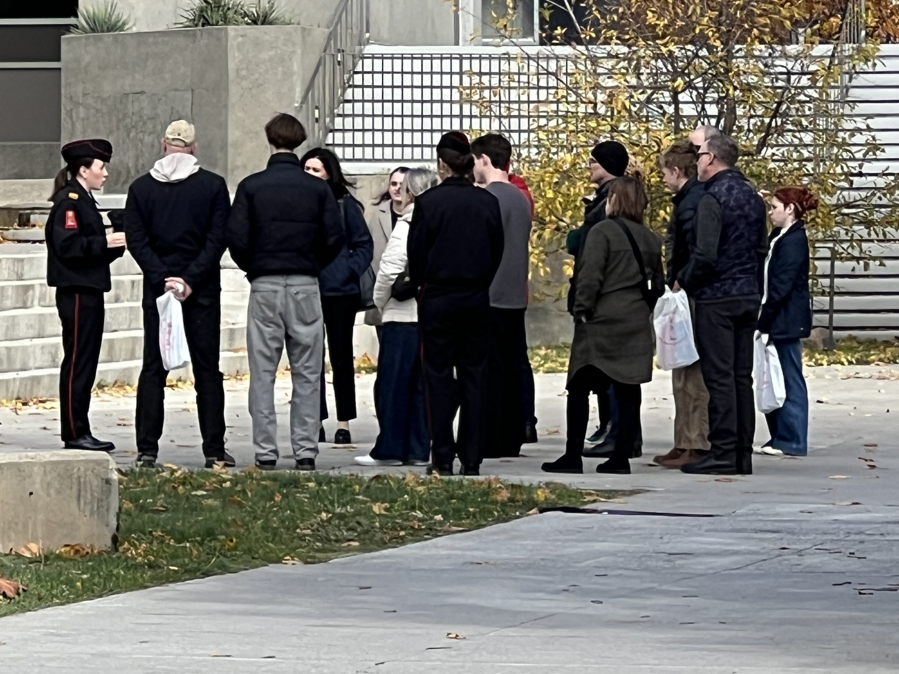 Visitors briefed outdoor by an office cadet