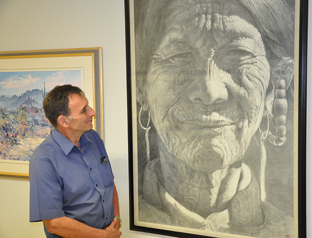 Ross McKenzie with portrait of aboriginal woman