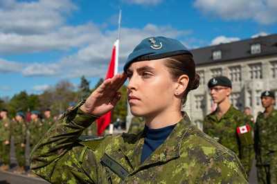 Salute: Naval and Officer Cadets at attention on a parade square. Salute: Naval and Officer Cadets at attention on a parade square.