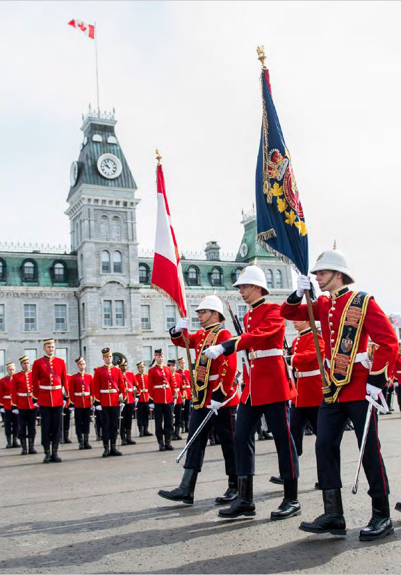 Officer cadets in scarlets on parade in front of McKenzie building
