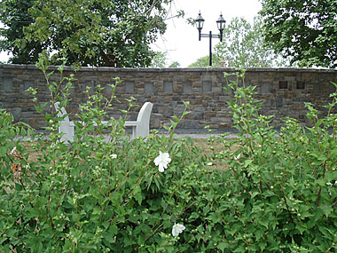 Wall of Honour in the Spring with gardens, seating and lighting