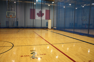 SAM gymnasium court 2 facing court 1 and the Canadian flag